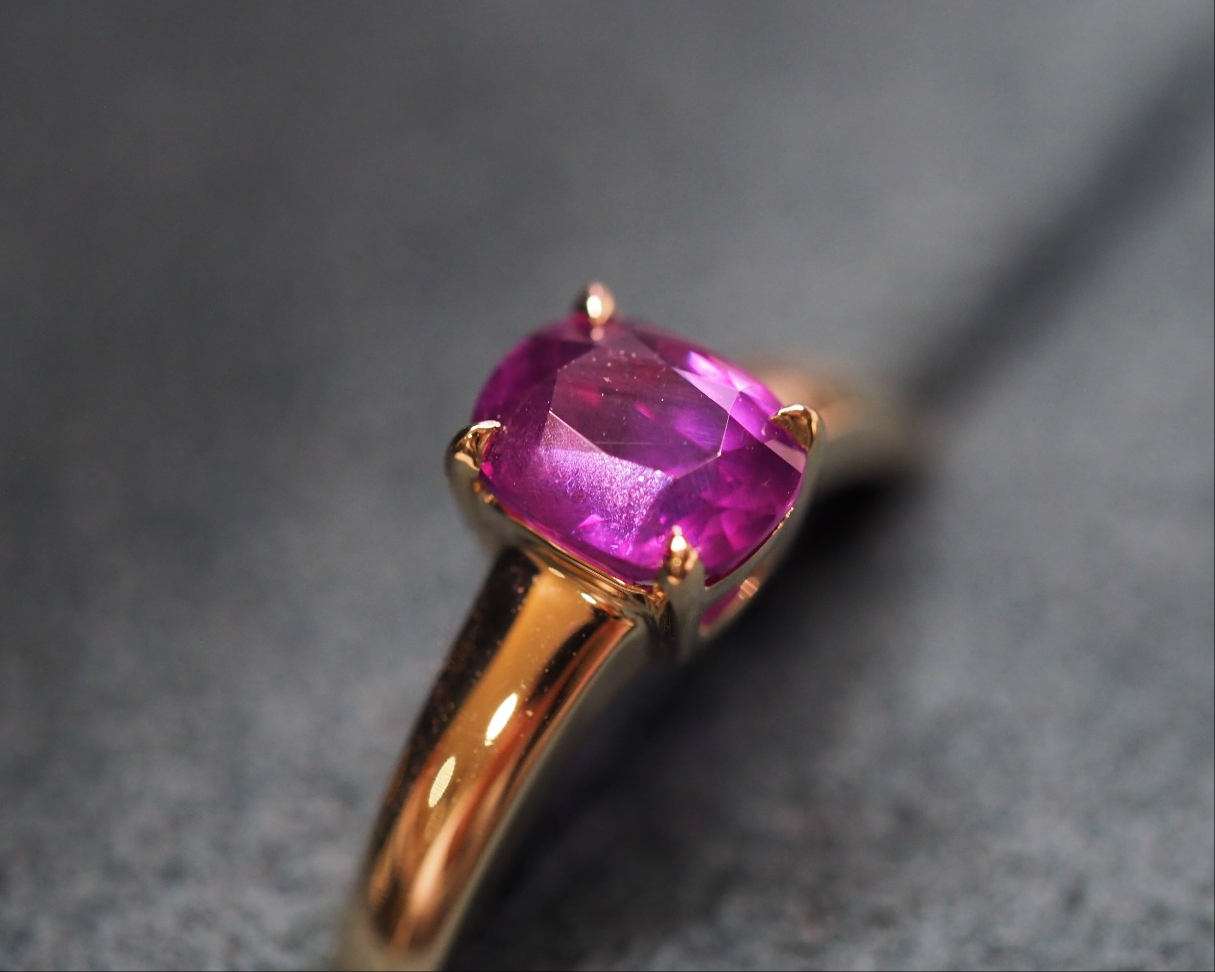 Close up purple sapphire stone set in a ring