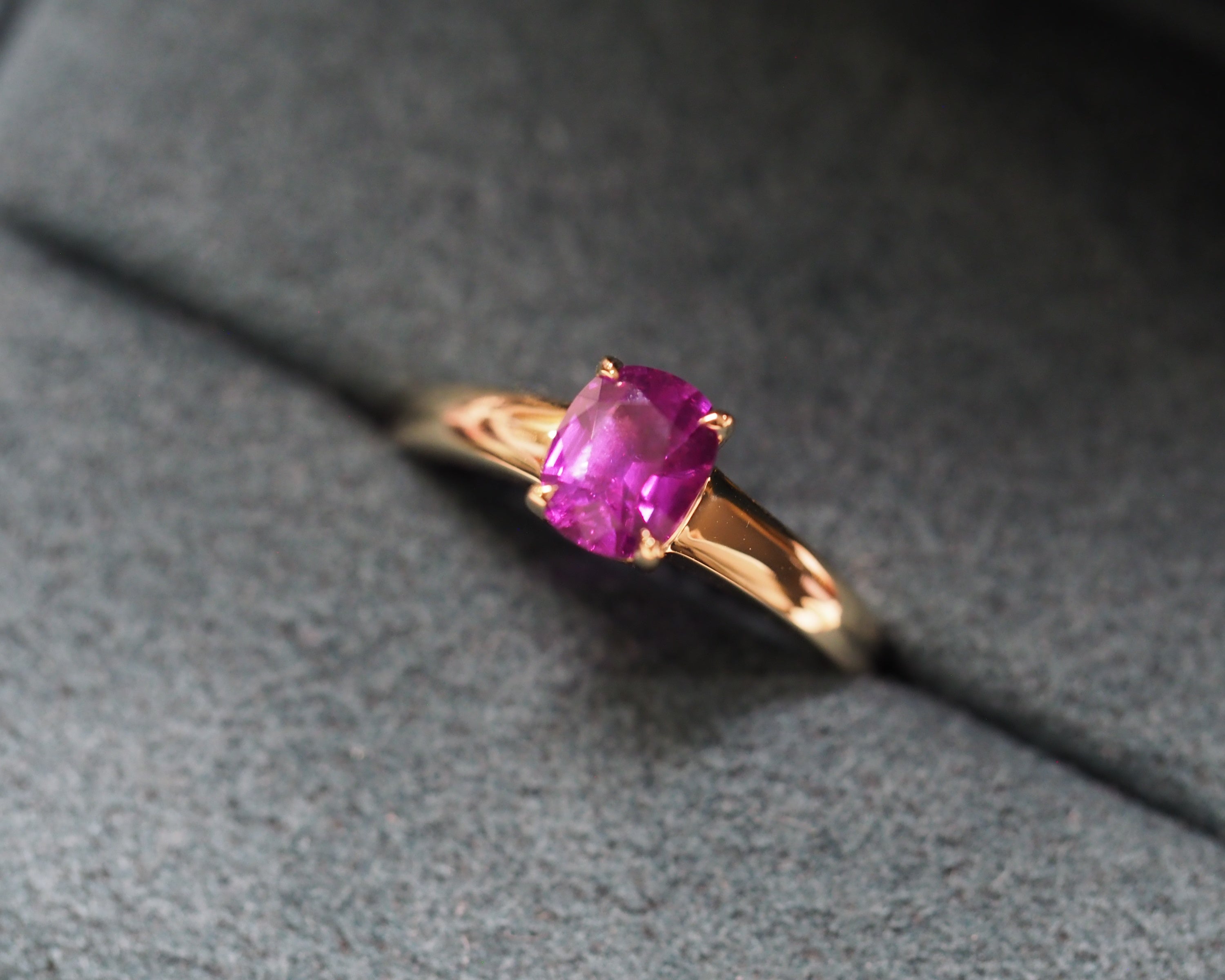 Purple stone ring in a box